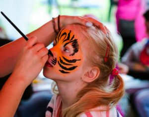 face painter at a girls birthday party