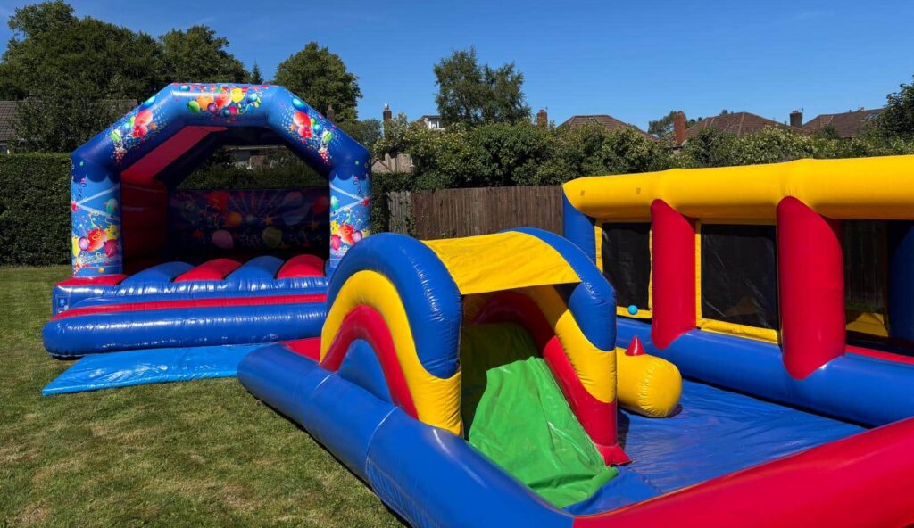 Kingdom Castles NI birthday party set up with colourful bright bouncy castles bouncy castle hire in ballymena Best party supplier Antrim BT41 for children's party